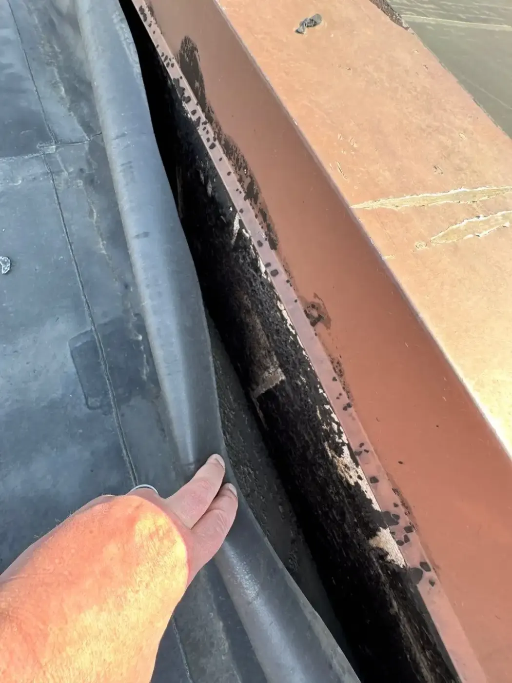 Tarping and dry-in on a Lawrence commercial roof